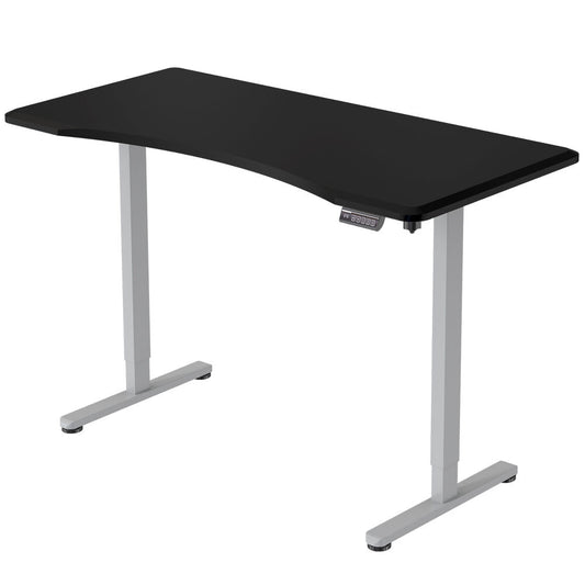 Image of fortia sit to stand up standing desk, 160x75cm, 72-118cm electric height adjustable, ergonomically curved edge, 50kg rated, black/silver frame  suitable for aged care, corporate offices, and commercial settings