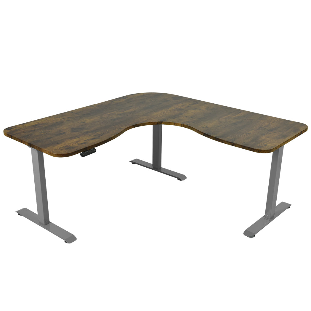 Image of fortia 173w x 173w x 75d 3-motor 120kg load adjustable electric sit to stand up corner desk - walnut/silver frame suitable for aged care, corporate offices, and commercial settings