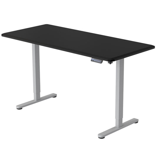 Image of fortia sit to stand up standing desk, 150x75cm, 72-118cm electric height adjustable, 50kg rated, black/silver frame  suitable for aged care, corporate offices, and commercial settings