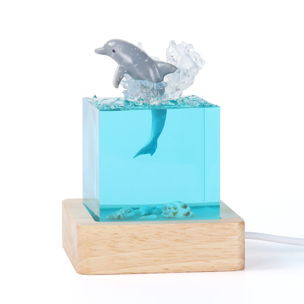 Image of shell dolphin jumping handcrafted ocean resin whale night light - unique home decor table lamp ideal for luxury casual home interiors