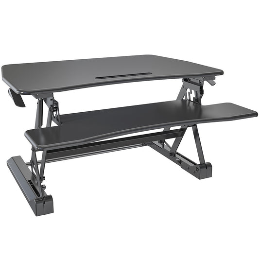 Image of fortia desk riser 90cm wide adjustable sit to stand for dual monitor, keyboard, laptop, black  suitable for aged care, corporate offices, and commercial settings