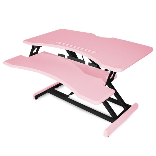 Image of fortia desk riser 77cm wide adjustable sit to stand for dual monitor, keyboard, laptop, pink  suitable for aged care, corporate offices, and commercial settings