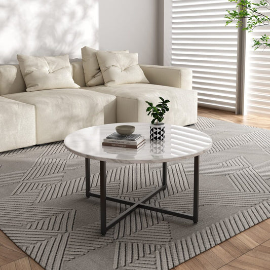 Image of white marble effect round coffee table with black legs  ideal for luxury casual home interiors