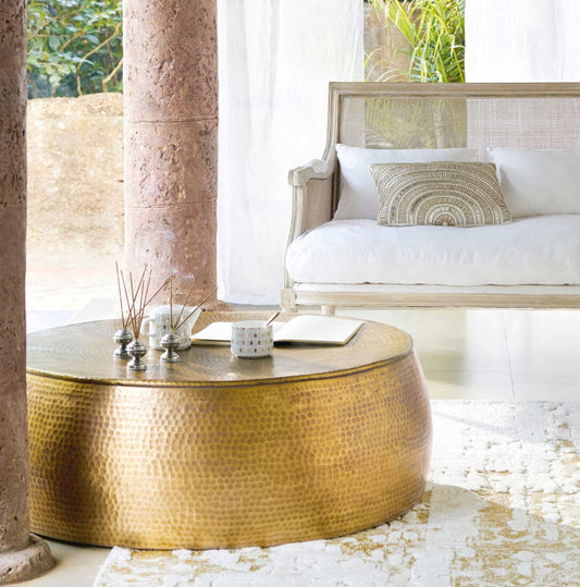 Image of brass look hammered coffee table  ideal for luxury casual home interiors