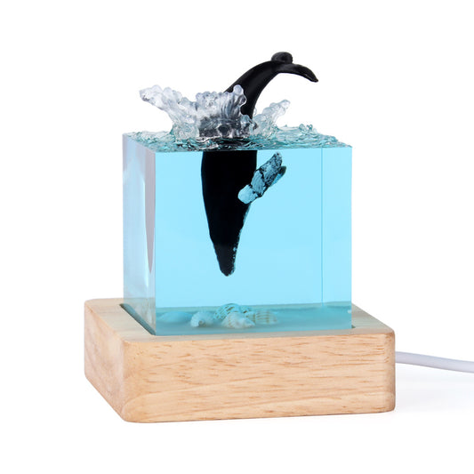 Image of shelling humpback whale into the water handcrafted ocean resin whale night light - unique home decor table lamp  ideal for luxury casual home interiors