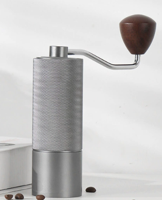 Image of silver premium manual coffee grinder with adjustable ceramic burr - compact and durable for perfect coffee grinding  ideal for luxury casual home interiors