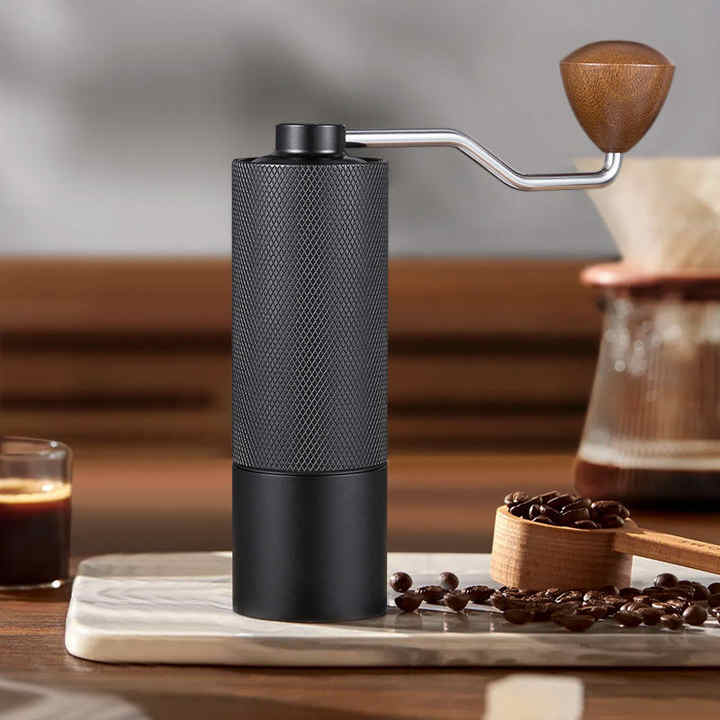 Image of black premium manual coffee grinder with adjustable ceramic burr - compact and durable for perfect coffee grinding  ideal for luxury casual home interiors