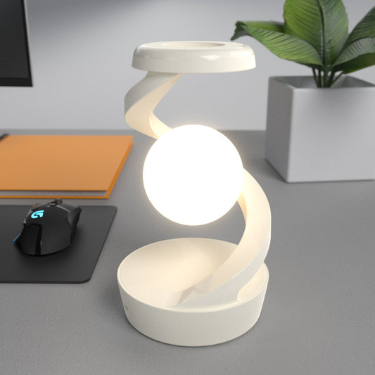 Image of white modern levitating led desk lamp with wireless phone charger - spiral design atmosphere light  versatile for both home and professional use